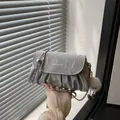Silver wrinkled leather crossbody bag with chain strap and plush charm detail - With Pendant / Silver