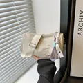 Cream white nylon pillow shoulder bag with embroidery and colorful braided cord - Khaki