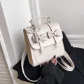 Creamy white butterfly backpack in synthetic leather with elegant pearl bow charm - With Pendant / White