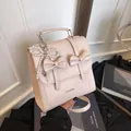 Light pink vintage butterfly backpack with pearl pendant and top handle for women - With Pendant / Pink