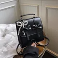 Chic black PU leather backpack with bows, silver text and pearl butterfly charm - With Pendant / Black