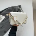 Modern white minimalist envelope bag with square metal buckle and woven chain strap - White