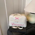 Borsa a tracolla in pelle PU bianco crema con ricamo a fiocco rosa e spalline versatili - Bianco