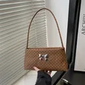 Vintage brown shoulder bag with monogram texture and silver metal butterfly charm - Monogram Brown