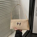 Beige vintage monogram underarm bag with a silver metallic butterfly clasp detail - Monogram Rice
