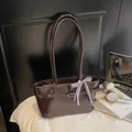 Dark brown oil wax leather shoulder bag featuring a vintage bow and metal buckle accent - Coffee