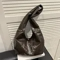 Dark brown faux leather tote bag with silver star stud patterns and wide strap - Brown