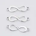 Three vintage silver alloy infinity symbol connectors for DIY jewelry making and crafts - Antique Silver
