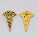 Pair of vintage gold alloy Caduceus pendants with detailed medical wing and snake texture - 30x20 / Antique Gold