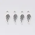 Set of four vintage silver zinc alloy wing charms with hollow feather detail for DIY jewelry - Antique Silver