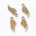 Set of four vintage bronze wing charms with detailed feather texture for DIY jewelry making - Antique Bronze