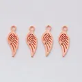 Close-up of four rose gold wing charms for DIY jewelry making with top hanging rings - Rose Gold