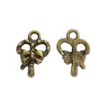 Antique bronze candy cane alloy charms for DIY jewelry making with festive bow details - Antique Bronze