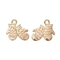 Macro detail of two golden vintage mitten charms with delicate bow textures and top loops - KC Gold