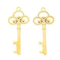 Detail of vintage zinc alloy key bottle openers with ornate cutout patterns in gold finish - Antique Gold