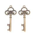 Vintage bronze key pendants with ornate scrollwork and bottle opener functionality - Antique Bronze