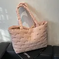 Pink quilted tote bag with bow pattern and diamond stitching for women's casual use - Pink