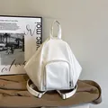 Minimalist white geometric leather backpack with front pocket for daily commute - White