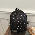 Schwarzer Mini-Rucksack mit rosa Blumendruck und wasserabweisendem Nylonmaterial - Schwarz
