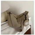 Earth tone crescent crossbody bag in wrinkled nylon with small round coin purse accessory - Khaki