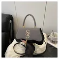 Gray striped and black leather handbag with gold SS logo and elegant metal fringe - Black