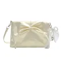 Ballet style cream shoulder bag with bow pleats and pearl pendant detail - Pearlescent Yellow