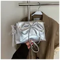 Metallic silver ballet style shoulder bag with pearl bow detail and lace charm - With Lace Pearl Charm / Silver