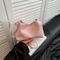 Pink pleated dumpling bag with pearl strap and white lace bow detail for women - With Pendant / Pink