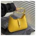 Minimalist yellow PU leather underarm bag with gold chain strap and metal lock detail - Yellow
