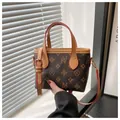 Retro bucket tote bag in dark brown monogram canvas with camel leather trim and handles - Deformed Letter Floral Print