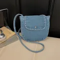 Vintage blue denim crossbody bag with silver buckle and white contrast stitching detail - Denim Flap Crossbody Bag / Light Blue