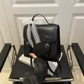 Fashionable black PU leather backpack with large white lace bow and metal buckles - Black