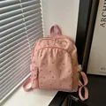 Pink mini backpack with floral tulip embroidery and durable nylon fabric for daily use - Pink
