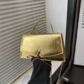 Elegant gold crocodile pattern handbag with V-shaped buckle and gold chain strap - Gold