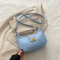 Sky blue crescent shoulder bag with golden triangle lock and adjustable strap - Blue
