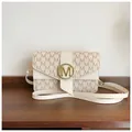Chic beige crossbody bag featuring brown M-letter patterns and a gold buckle closure - Off White
