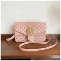 Pink crossbody bag with 'M' pattern texture and sparkling gold rhinestone buckle - Pink