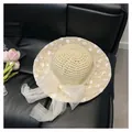 Straw sun hat with white mesh bow and floral embroidery details in light beige - Bow Lace Straw Hat / Beige