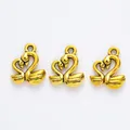Three vintage gold swan heart charms for DIY jewelry making in polished zinc alloy - Antique Gold