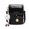 Glossy black leather crossbody bag with gold lettering and a cute fuzzy monster charm - Black