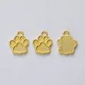 Drei goldene Bärentatzen-Anhänger aus Zinklegierung für DIY-Schmuck auf weißem Grund - Gold