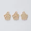 Detailansicht von drei goldenen Bärenpfoten-Anhängern aus Legierung für DIY-Schmuck - KC Gold