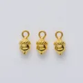 Three gold acorn pendants for DIY jewelry making shown against a clean white background - Gold
