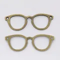 Vintage bronze alloy glasses charm pendants for DIY jewelry making and clothing accessories - 55*19mm / Antique Bronze
