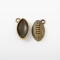 Antique bronze football pendants in zinc alloy showing front and back texture details - Antique Bronze