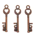Detailed macro view of three vintage bronze heart-shaped keys featuring love word design - Antique Red Copper