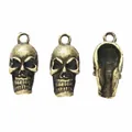 Vintage bronze skull pendant in three views showing front, side and hollow back structure - Antique Bronze