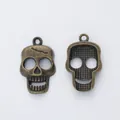 Vintage bronze skull charms with detailed relief and back texture for DIY jewelry making - Antique Bronze