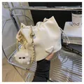 White drawstring bucket bag with gold chain strap and cute plush toy pendant - With Plush Charm / Cream