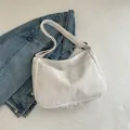 White corduroy crossbody shoulder bag for women with minimalist half-moon design - White